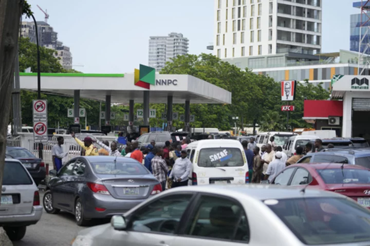 Drivers line up for gasoline across Nigeria after new president scraps fuel subsidy