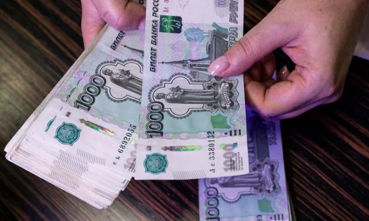 Russian rouble pares losses vs dollar in volatile trade