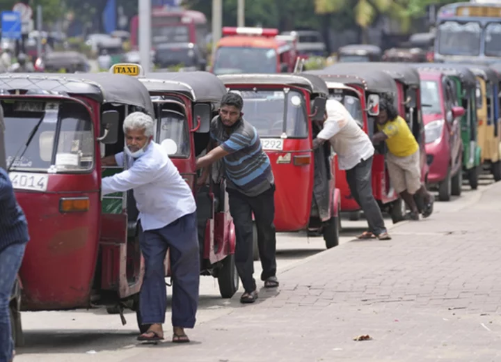 Sri Lanka's Parliament approves a debt restructuring plan in an attempt to overcome economic crisis