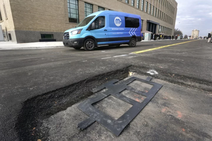 New technology installed beneath Detroit street can charge electric vehicles as they drive