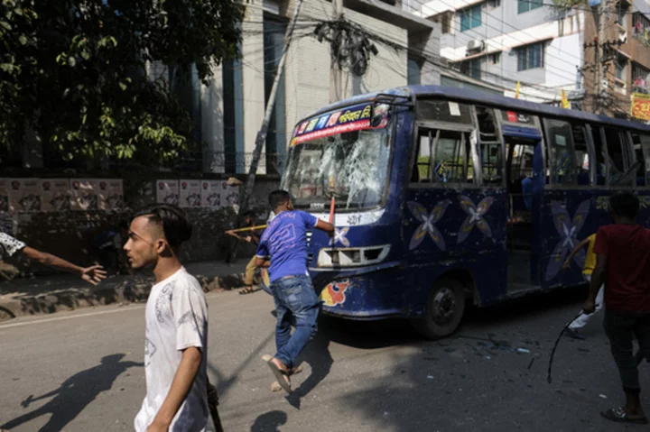 Thousands of Bangladesh’s garment factory workers take to the streets demanding better wages