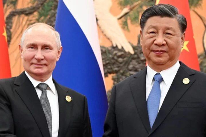 Russian President Putin and Chinese leader Xi meet in Beijing and call for close policy coordination