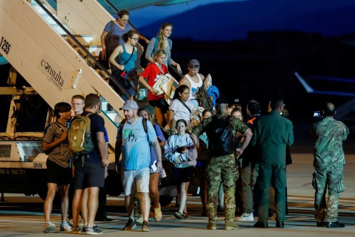 Planes carrying evacuees from Niger land in Paris and Rome