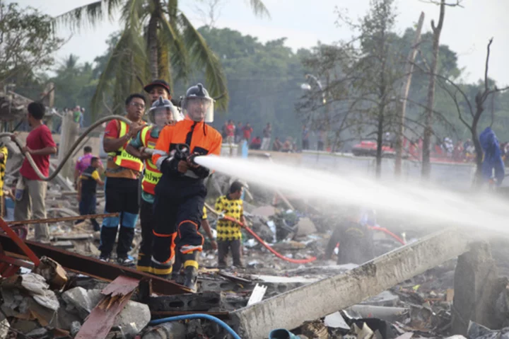 A large explosion at a fireworks warehouse in Thailand kills at least 10 people and wounds scores