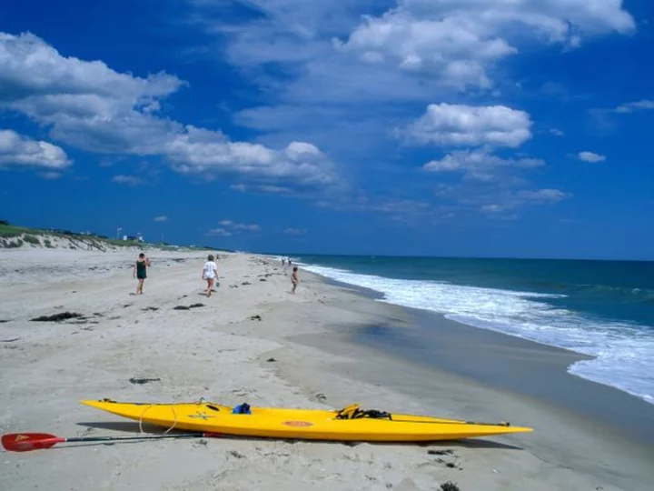 A man swimming at a Long Island beach was bitten, possibly by a shark, police say