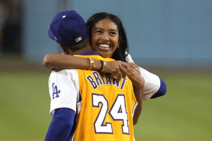 Kobe Bryant's daughter Natalia tosses first pitch on Lakers Night at Dodger Stadium