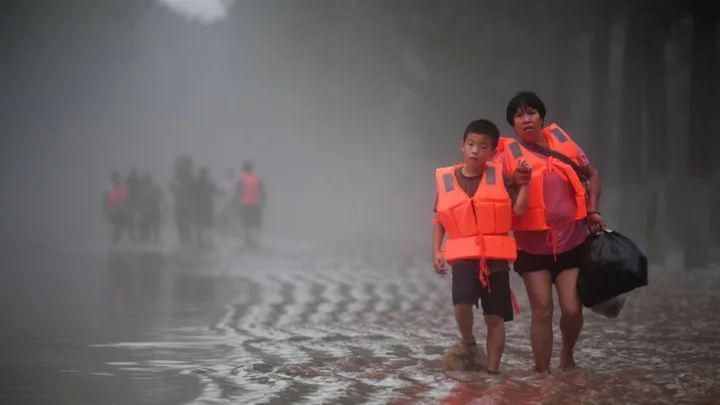 China floods: The families torn apart by 'huge, furious waves'