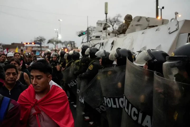 Protesters take to Peru's streets, some met with tear gas in capital