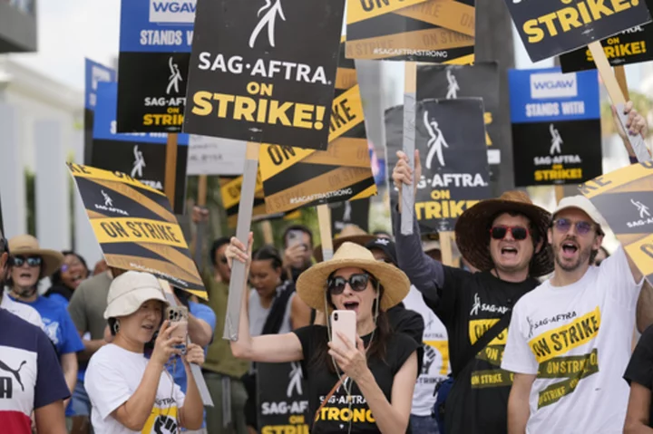 Hollywood writers vote to approve contract deal that ended strike as actors negotiate