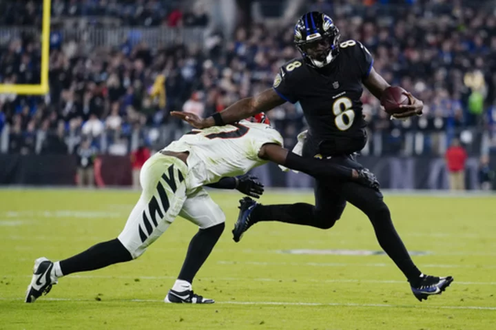 Ravens handle Bengals 34-20 after Joe Burrow exits in the 2nd quarter with a wrist injury