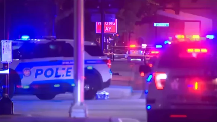 Manhunt for suspects after two Orlando police officers shot while stopping car linked to homicide