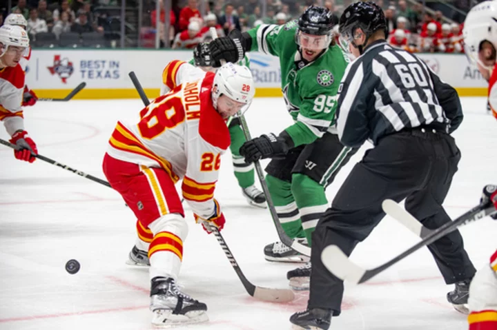 Coleman and Lindholm ignite 4-goal 3rd period for Flames in 7-4 win over Stars