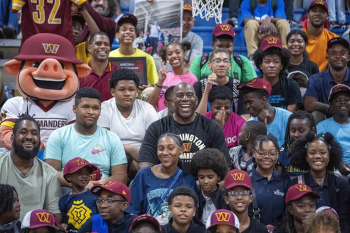 Magic Johnson, Josh Harris and other new Commanders owners introduce themselves to Washington fans