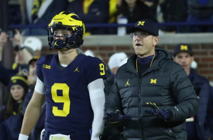 Michigan travel plans seem to indicate Jim Harbaugh will avoid discipline before Penn State game