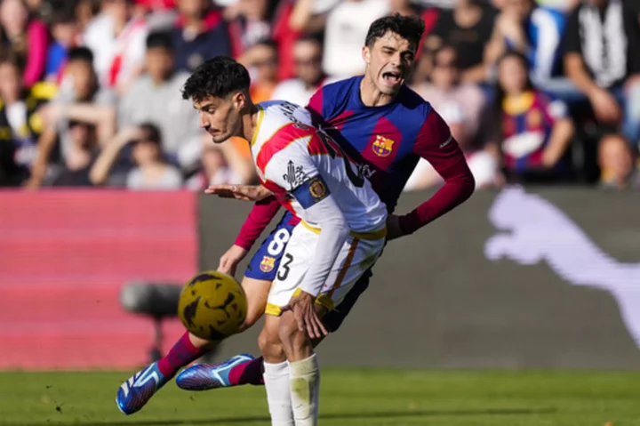 Barcelona needs own goal to salvage 1-1 draw at Rayo in Spanish league