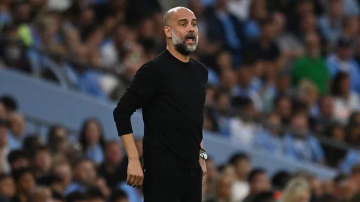 Pep Guardiola returns to Man City after emergency back surgery