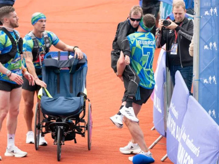 Kevin Sinfield carries friend and former teammate Rob Burrow across marathon finish line