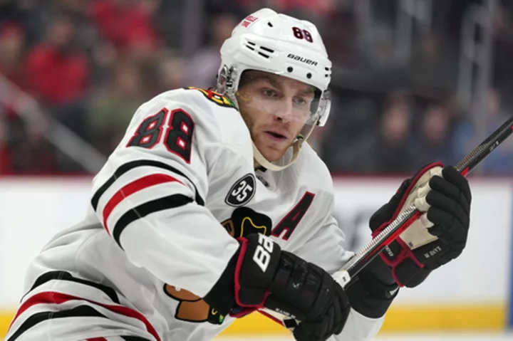 Patrick Kane is signing with the Detroit Red Wings, an AP source says