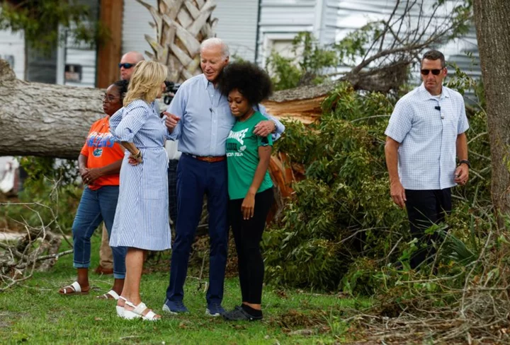 Biden surveys storm damage in Florida, without DeSantis